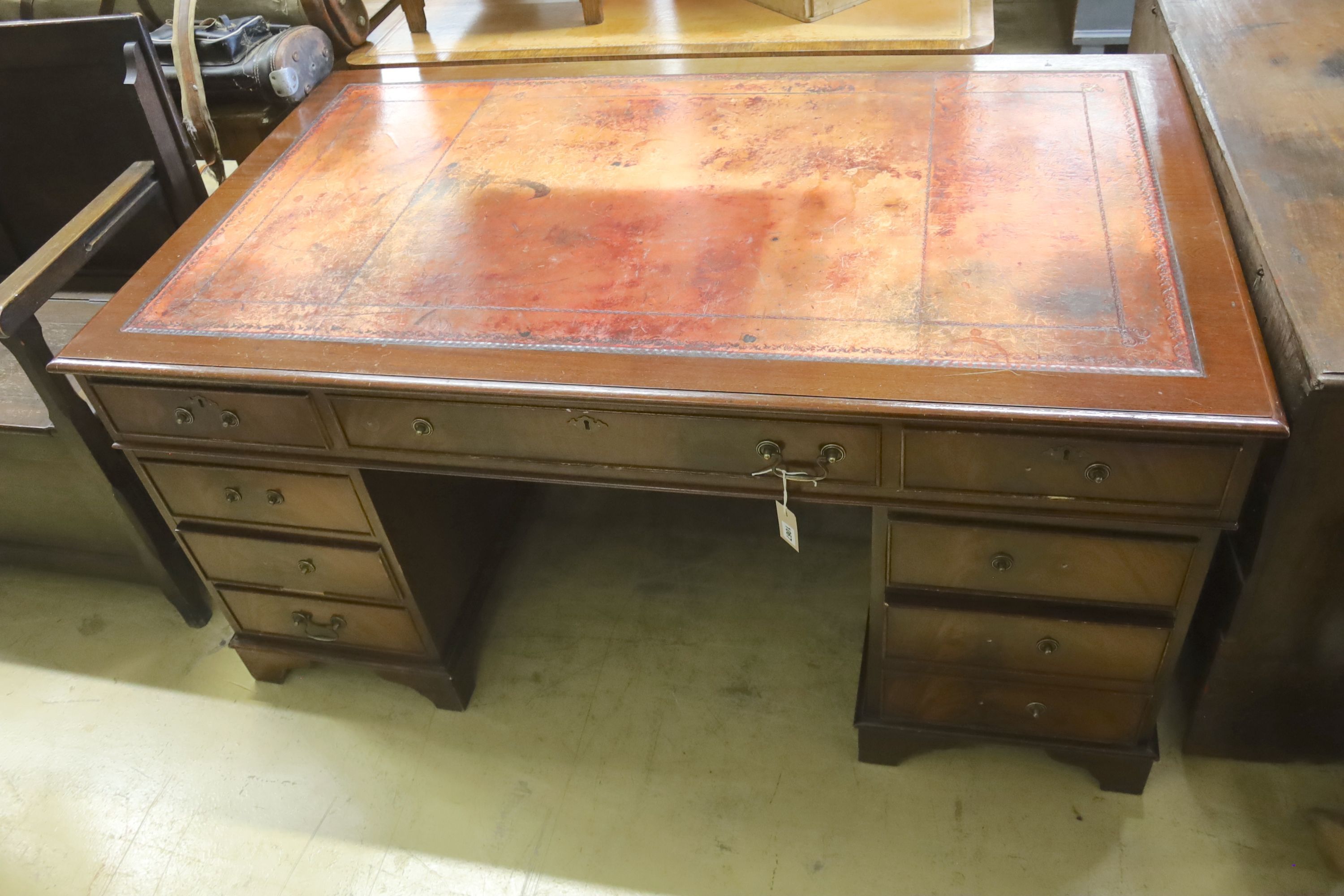 A reproduction mahogany pedestal desk, length 152cm, depth 91cm, height 74cm